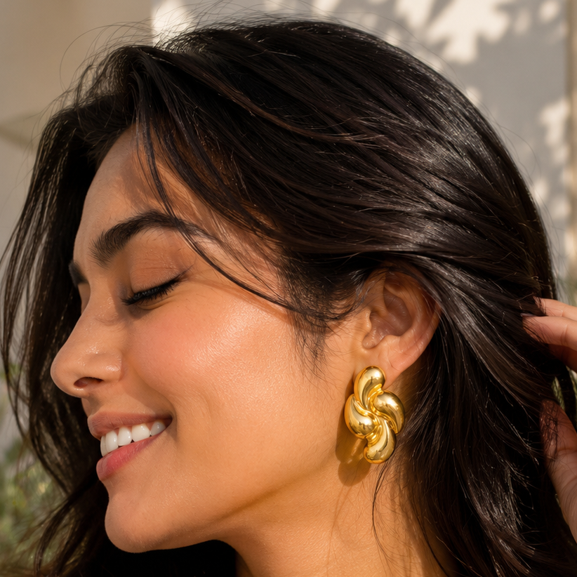 Swirling gold drops