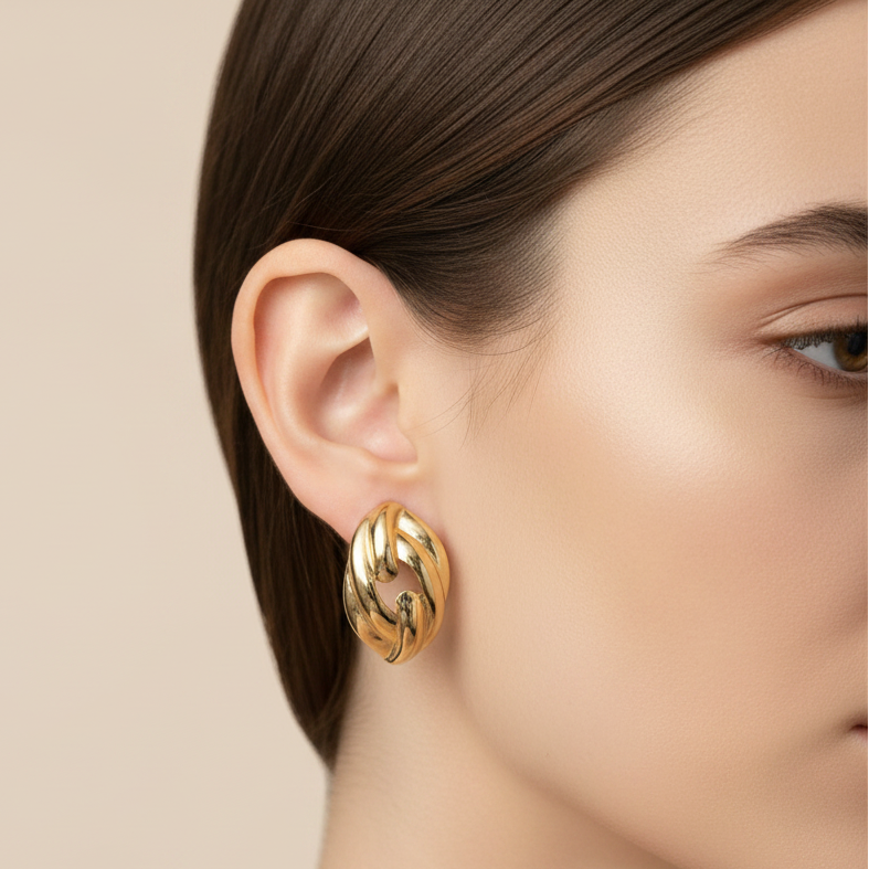 Bright side profile model with gold twisted hoop earring
