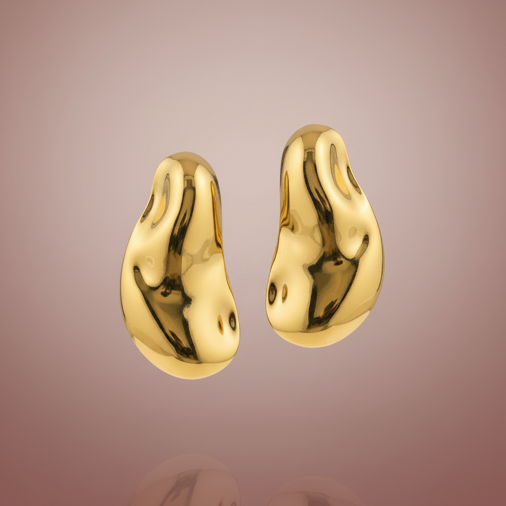 Gold dome earrings floating dusty rose background