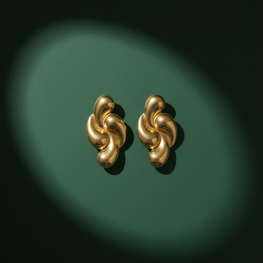 Gold swirl earrings minimal green background